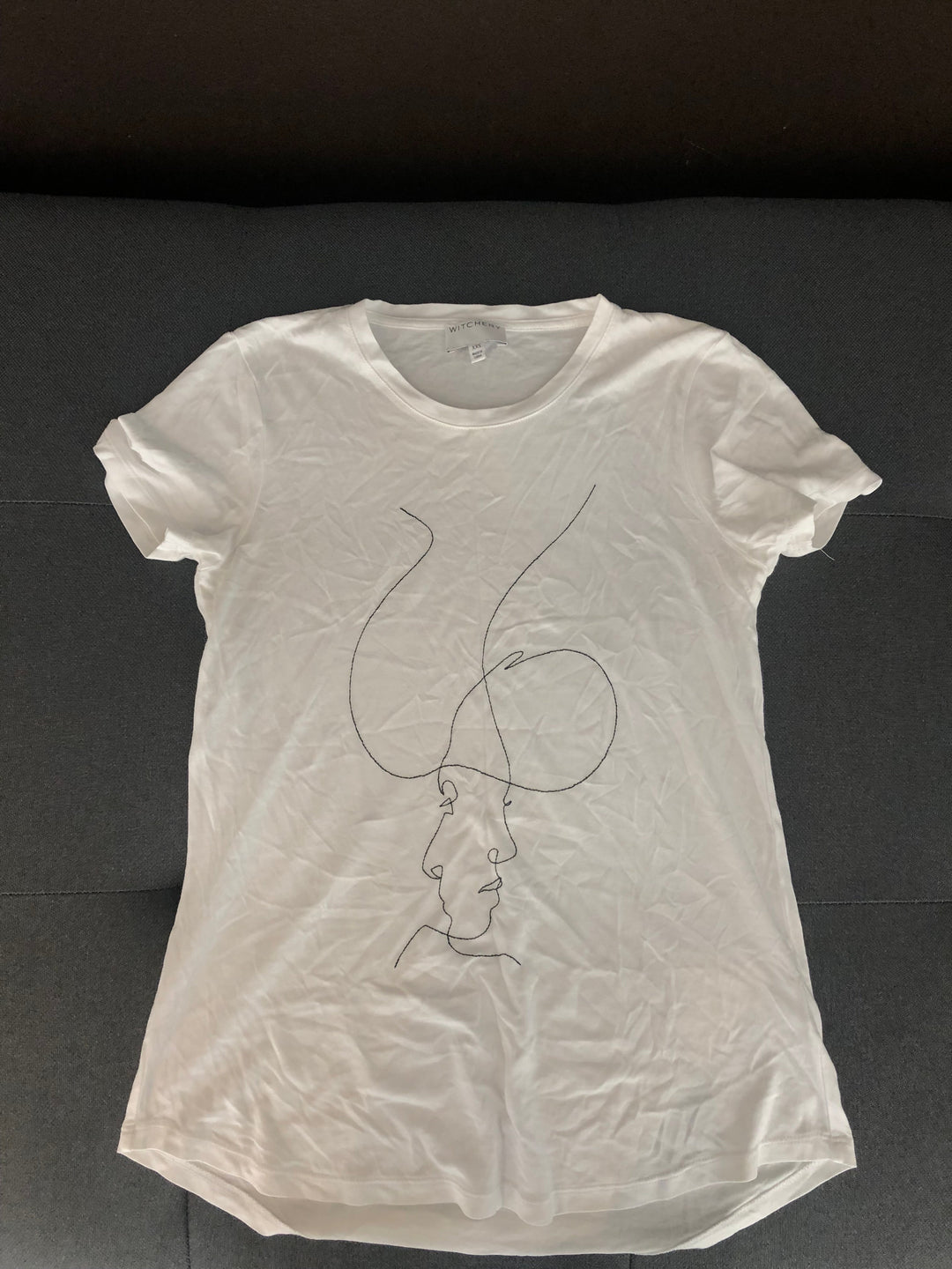 Image of White tee with face 